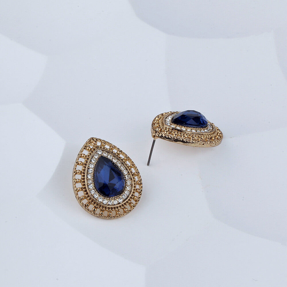 brown and blue earring